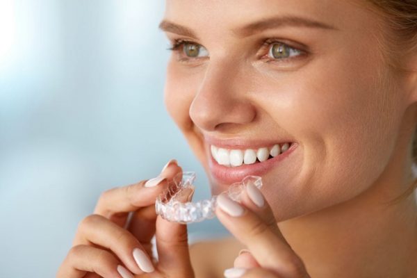 Young Woman About to Wear Invisalign Clear Aligners Photo